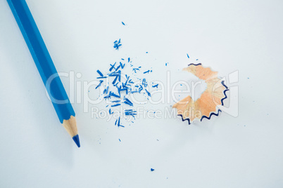 Close-up of blue color pencil with pencil shaving