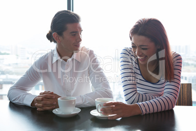 Man and woman having coffee