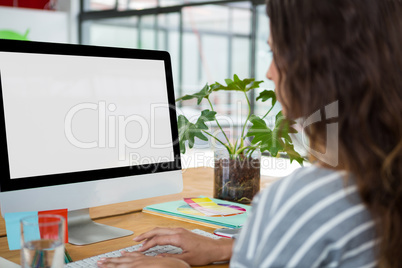 Female graphic designer working at desk