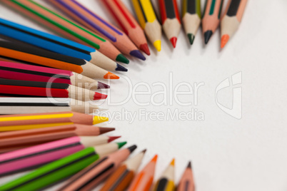 Colored pencils arranged in a semi-circle