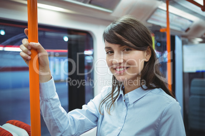 Executive smiling while traveling in train