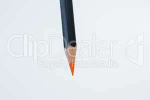 Orange color pencil on white background