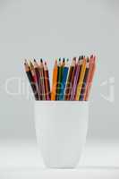 Colored pencils kept in cup