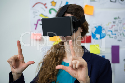 Woman using virtual reality headset Woman using virtual reality headset