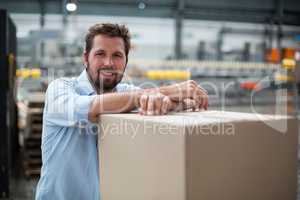 Smiling factory worker standing in factory