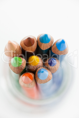 Close-up of colored pencils kept in a glass jar