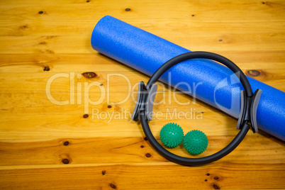 Exercise equipment kept on wooden floor