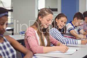 Students studying in classroom