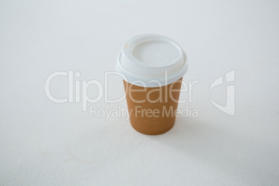 Disposable coffee cup on white background