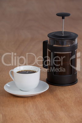 Cafetiere and a cup of black coffee