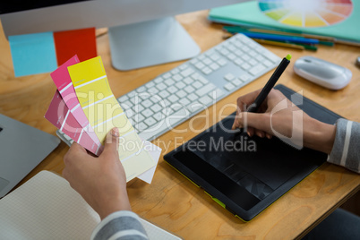 Female graphic designer working at desk