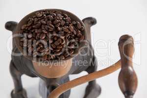 Vintage coffee grinder with coffee beans