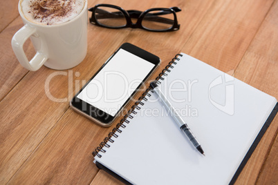 Coffee with organizer and mobile phone