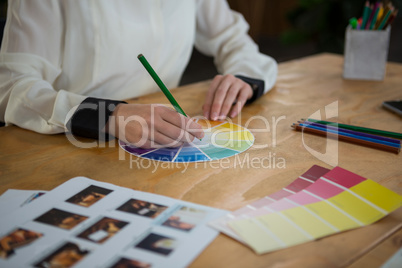 Female graphic designer working at desk