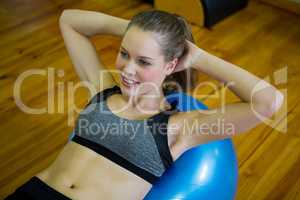 Beautiful woman exercising on fitness ball
