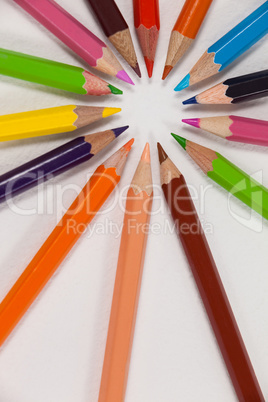 Close-up of colored pencils arranged in a circle