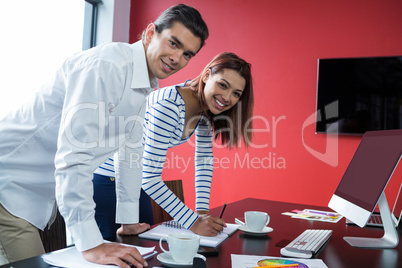 Man and woman working in office