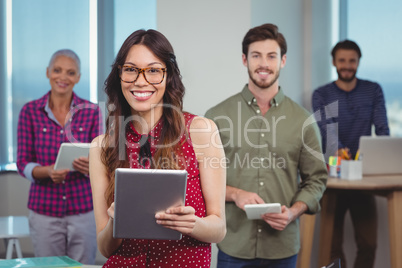Portrait of business executives using digital tablet Portrait of business executives using digital tablet
