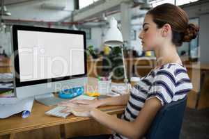 Female graphic designer working on computer