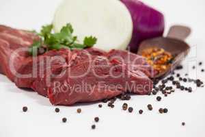 Beef steak and spices against white background