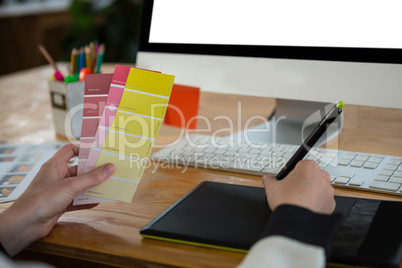 Female graphic designer working at desk