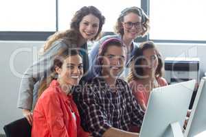 Smiling business executives working in office