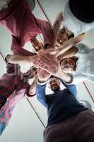 Team of businesspeople forming hand stack