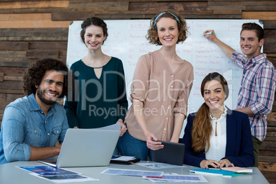 Business executives smiling in office