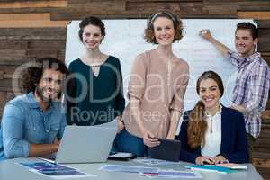 Business executives smiling in office