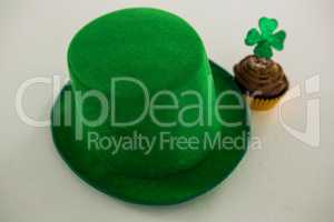 St Patricks Day leprechaun hat with shamrock on cupcake