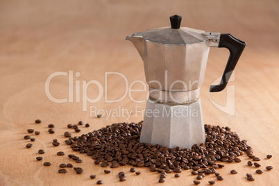 Metallic coffee maker with coffee beans