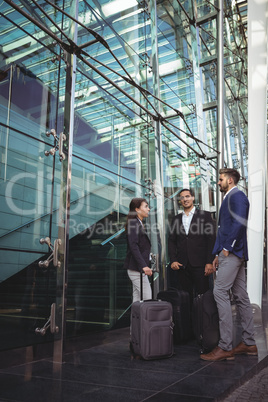 Businesses executives interacting with each other outside platform