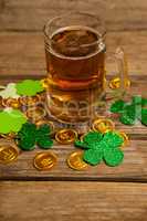 Mug of beer, chocolate gold coins and shamrock for St Patricks Day