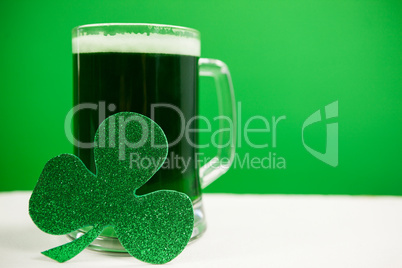 Mug of green beer and shamrock for St Patricks Day