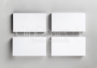 Four blank business cards