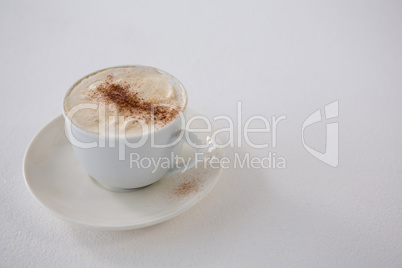 Close-up of coffee cup with creamy froth