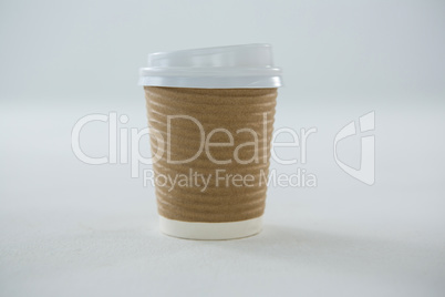 Disposable coffee cup on white background