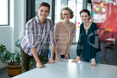 Business executives standing together in office