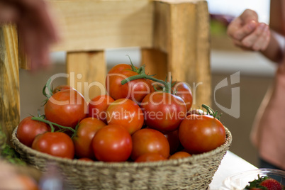 Basket of fresh tomatoes on the counter