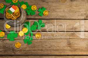 St. Patricks Day pot of chocolate gold coins with irish flag and shamrocks