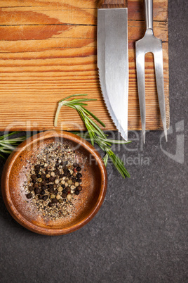 Wooden board and bowl of spices