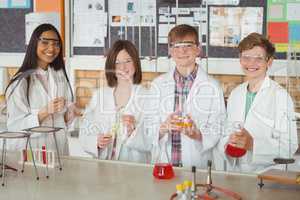 Portrait of school kids doing a chemical experiment in laboratory