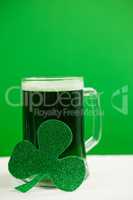 Mug of green beer and shamrock for St Patricks Day