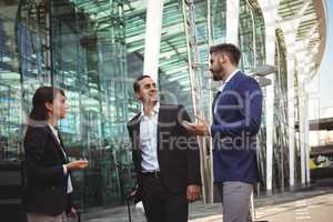 Businesses executives interacting with each other outside platform