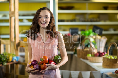 Woman holding vegetables at grocery store