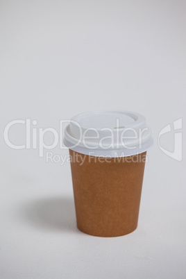 Disposable coffee cup on white background