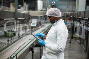 Factory engineer using digital tablet in the factory