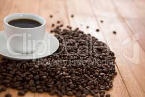 Black coffee with roasted coffee beans