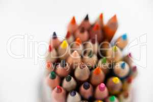 Close-up of colored pencils kept in a glass jar