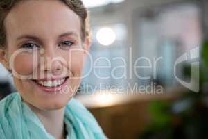 Beautiful woman smiling in office